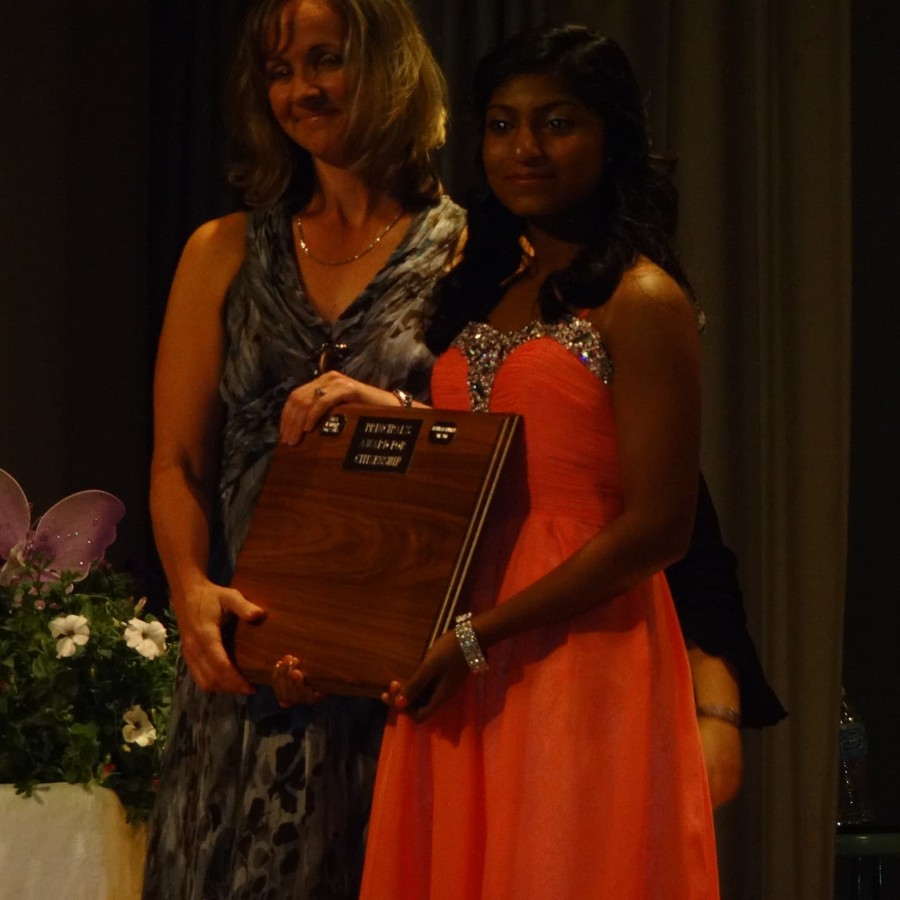Ravicha receiving a community award
